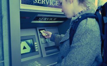 Young Woman Using ATM ca. 2001 Dublin, Ireland